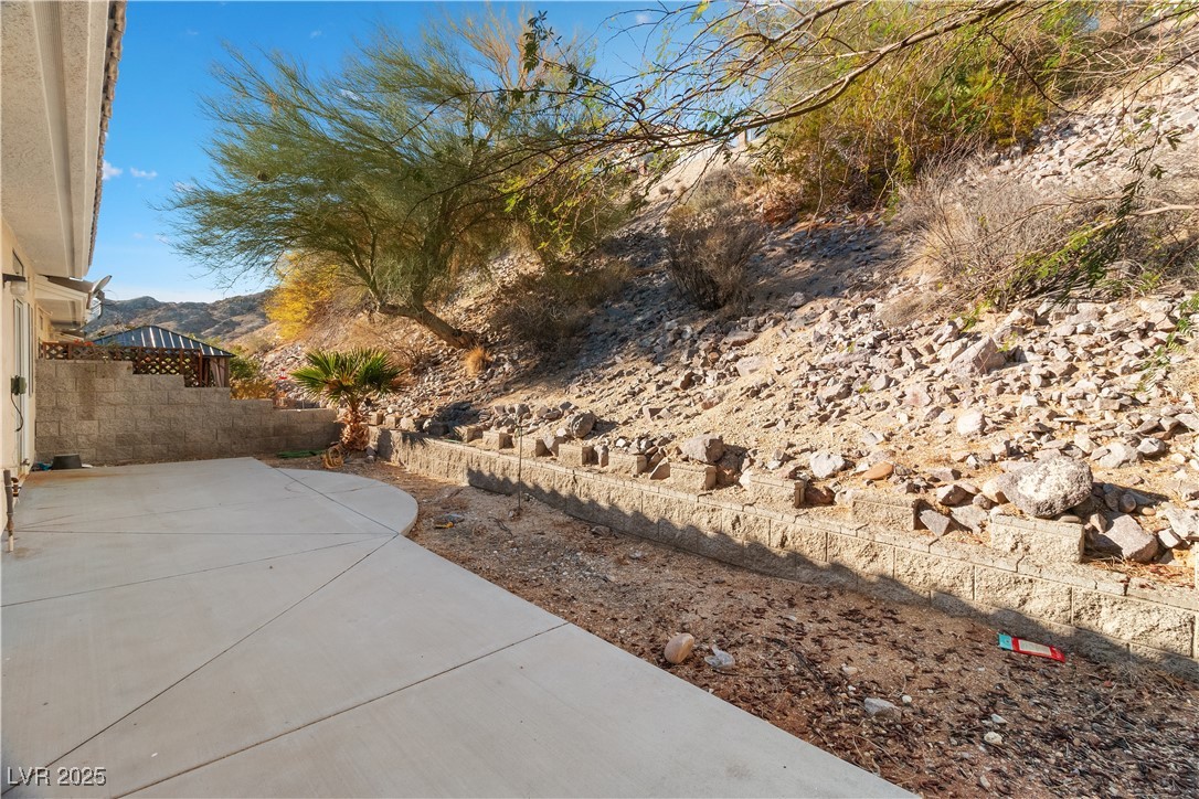 3342 Pheasant Canyon Way, Unit 1013 Laughlin, NV 89029 - Photo 49 of 74 View of backyard featuring a patio area, and a mou