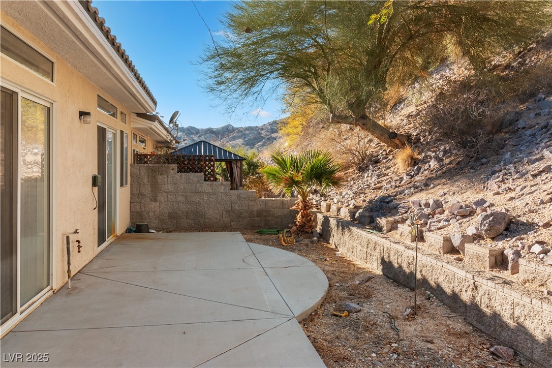 3342 Pheasant Canyon Way, Unit 1013 Laughlin, NV 89029 - Photo 50 of 74 View of patio with fence and a mountain view