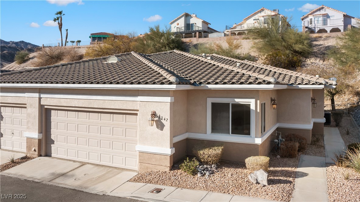 3342 Pheasant Canyon Way, Unit 1013 Laughlin, NV 89029 - Photo 54 of 74 View of front of house featuring concrete driveway