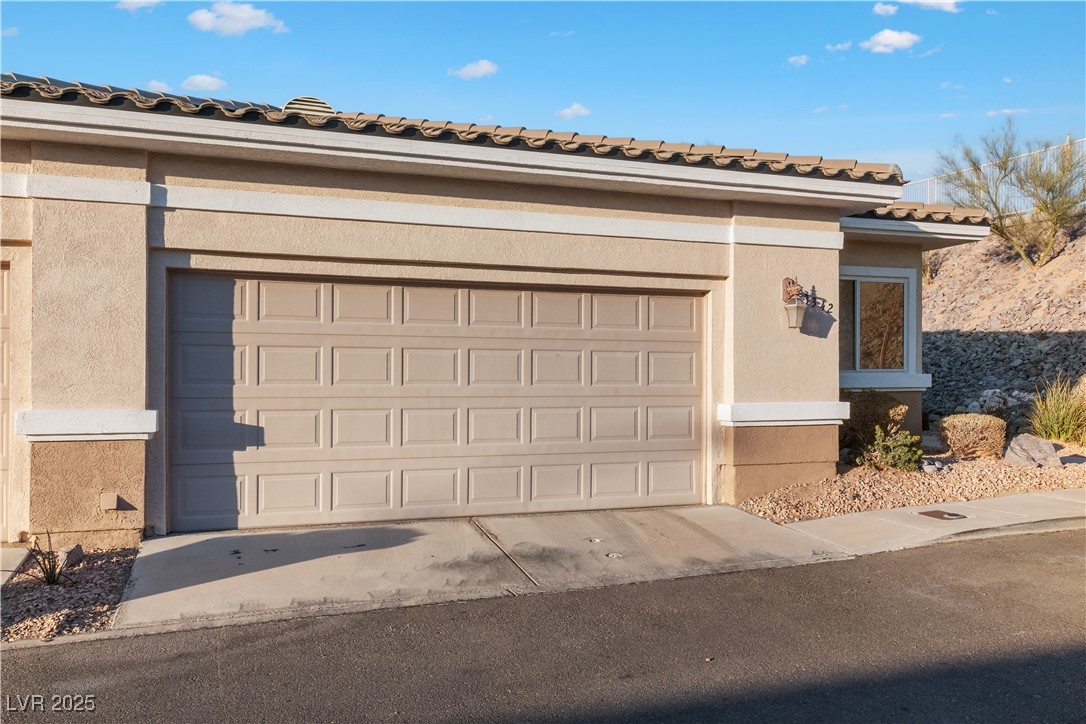 3342 Pheasant Canyon Way, Unit 1013 Laughlin, NV 89029 - Photo 60 of 74 Garage featuring concrete driveway