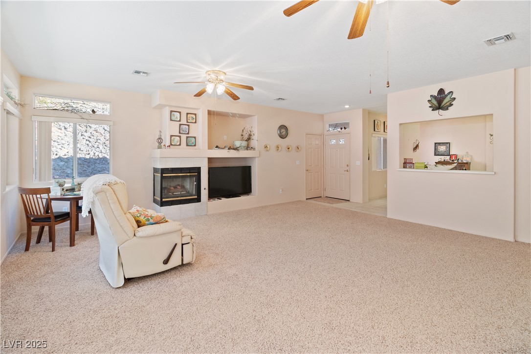 3342 Pheasant Canyon Way, Unit 1013 Laughlin, NV 89029 - Photo 6 of 74 Great room featuring ceiling fan, a tile fireplace