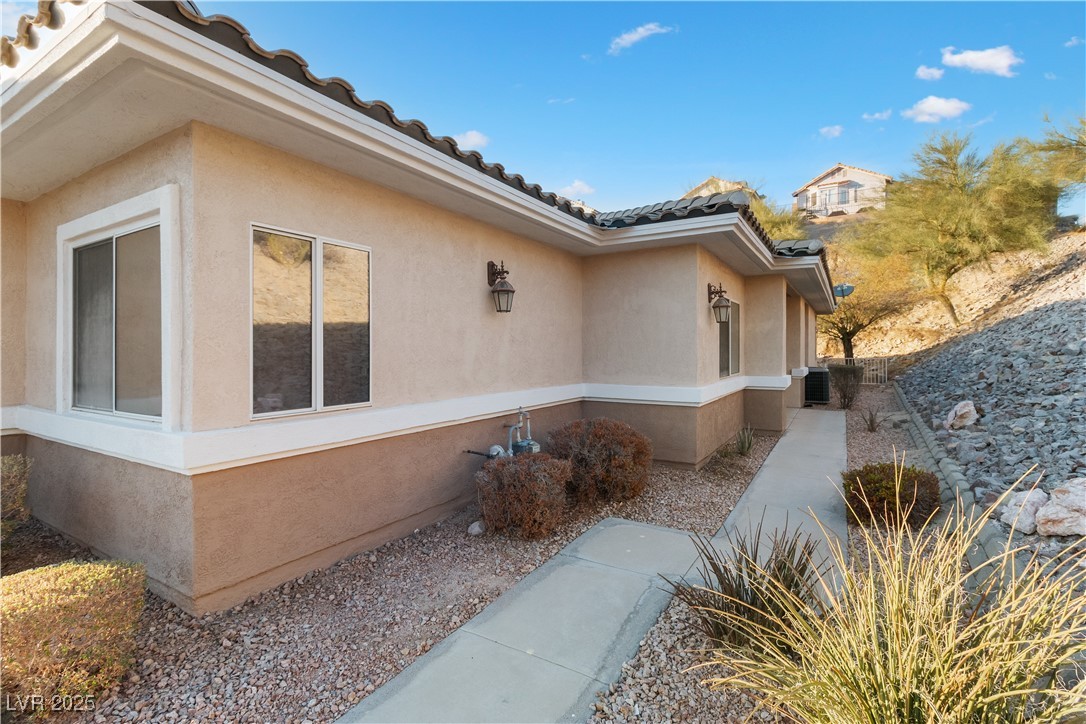 3342 Pheasant Canyon Way, Unit 1013 Laughlin, NV 89029 - Photo 61 of 74 View of home's exterior featuring a tiled roof, co