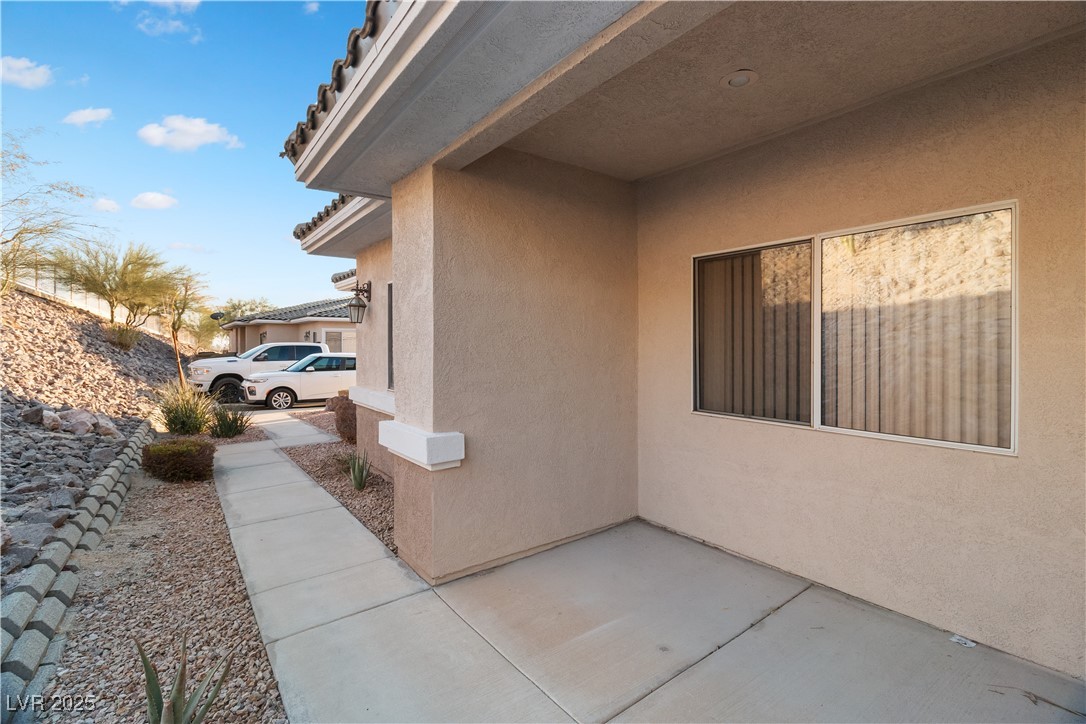 3342 Pheasant Canyon Way, Unit 1013 Laughlin, NV 89029 - Photo 62 of 74 View of side of property with a patio area and stu