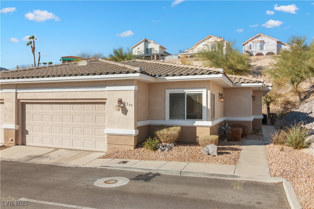 3342 Pheasant Canyon Way, Unit 1013 Laughlin, NV 89029 - Photo 63 of 74 View of front of home featuring concrete driveway,