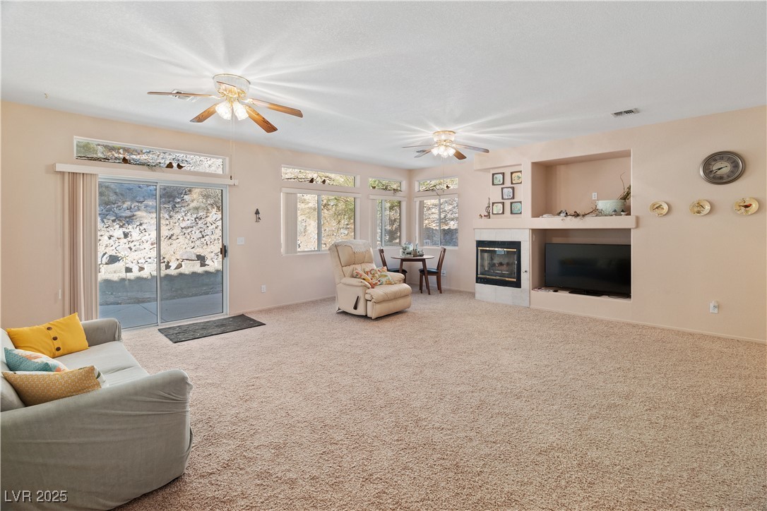 3342 Pheasant Canyon Way, Unit 1013 Laughlin, NV 89029 - Photo 7 of 74 Carpeted Great room featuring ceiling fan, a tile