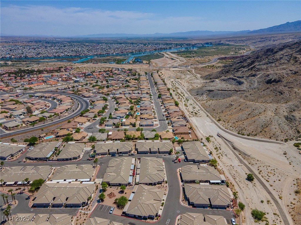3342 Pheasant Canyon Way, Unit 1013 Laughlin, NV 89029 - Photo 71 of 74 Drone / aerial view with a mountain view and a res