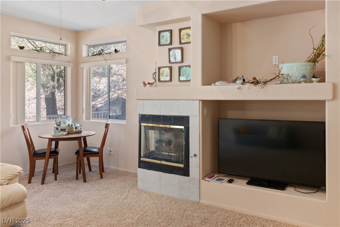 3342 Pheasant Canyon Way, Unit 1013 Laughlin, NV 89029 - Photo 8 of 74 Great room featuring carpet, a fireplace, and base