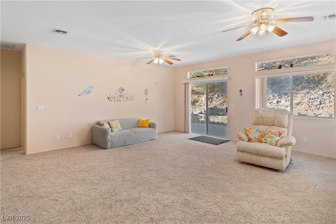 3342 Pheasant Canyon Way, Unit 1013 Laughlin, NV 89029 - Photo 9 of 74 Great area featuring carpet floors, ceiling fan, a