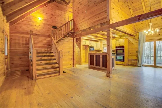 a view of empty room with wooden walls