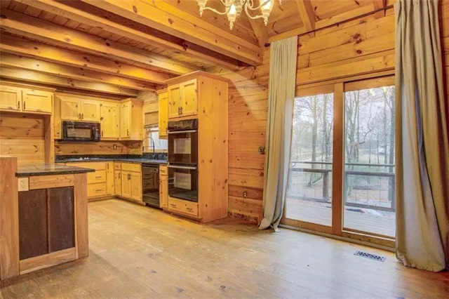 a kitchen with stainless steel appliances a refrigerator and stove