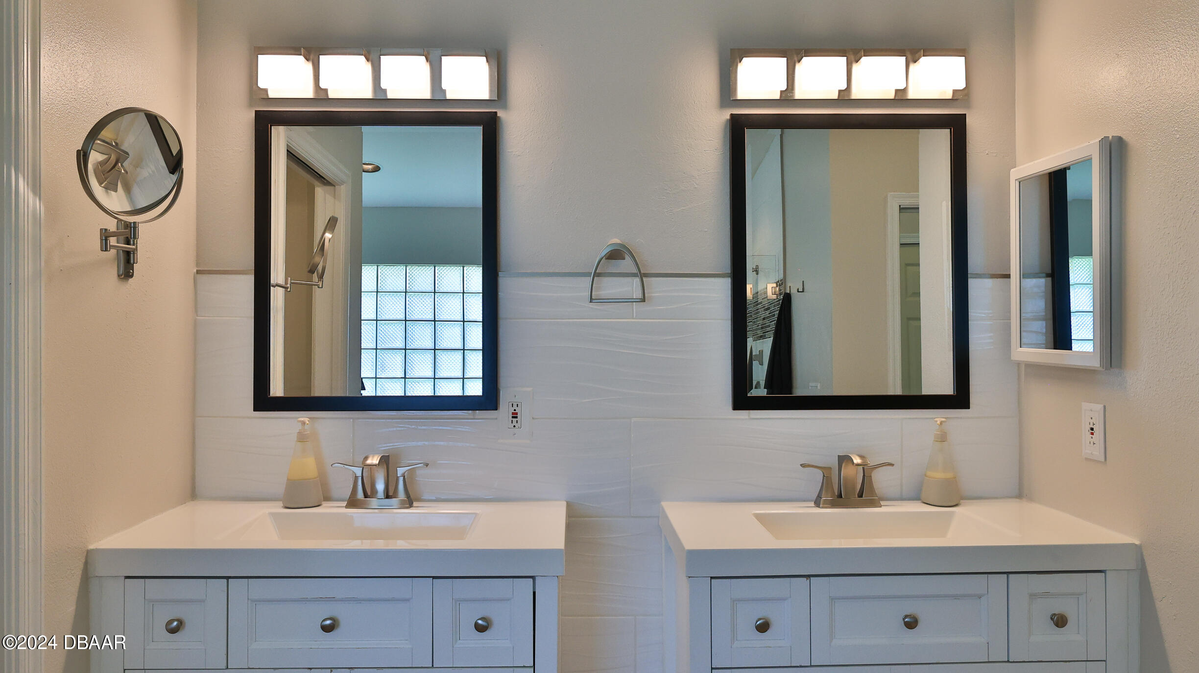16 Meadow Ridge View Ormond Beach, FL 32174 - Photo 27 of 45 a bathroom with double vanity sink and a mirror