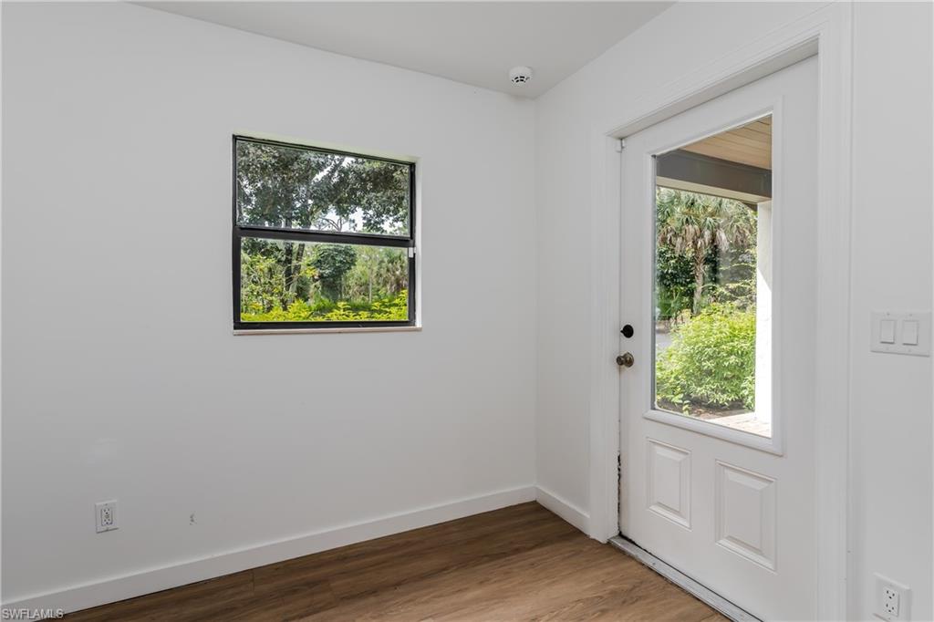 3301 31st Avenue Southwest Naples, FL 34117 - Photo 11 of 22 an empty room with a window