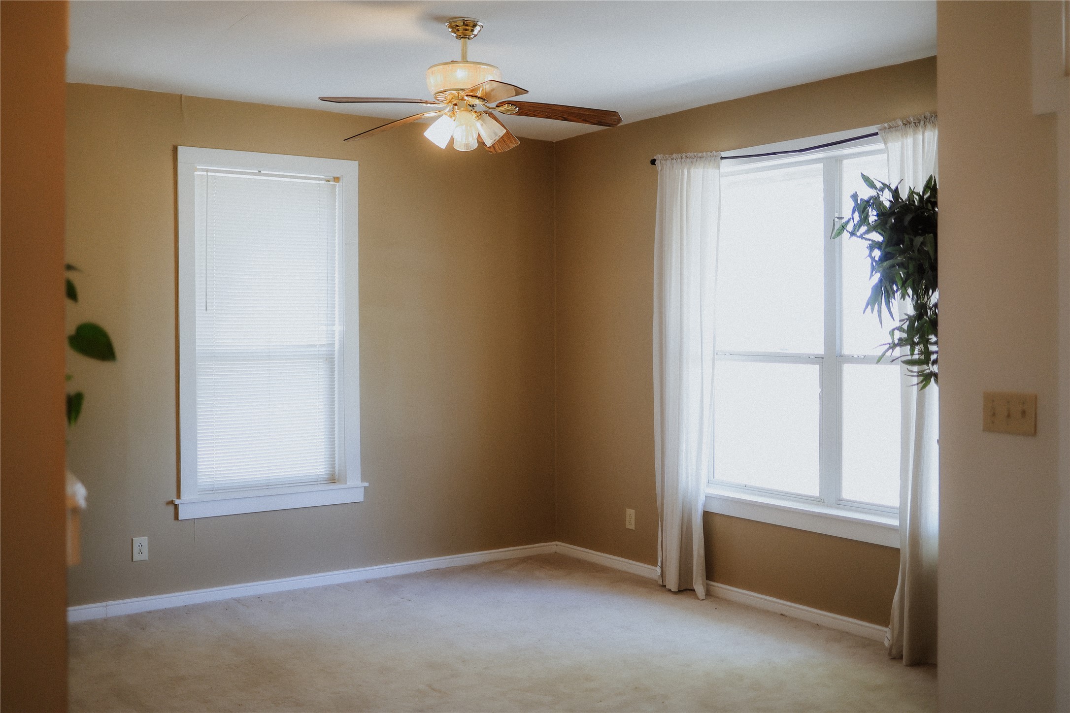17323 Manda Carlson Road Manor, TX 78653 - Photo 9 of 29 Natural light streams through multiple windows onto the neutral carpeting in this versatile space.