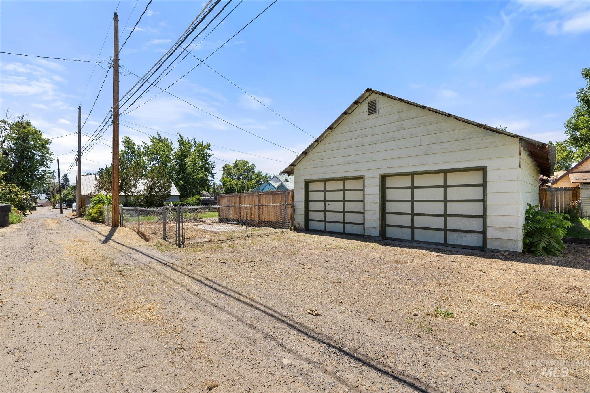 918 West 3rd Street Weiser, ID 83672 - Photo 36 of 36 Detached two-car garage with horizontal panel siding and two bay doors