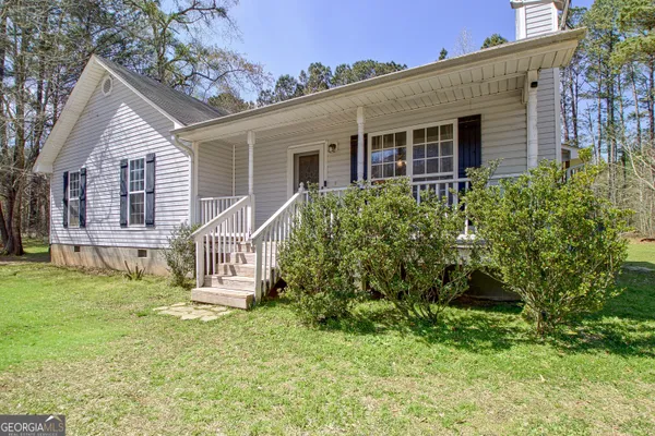 front view of a house with a yard