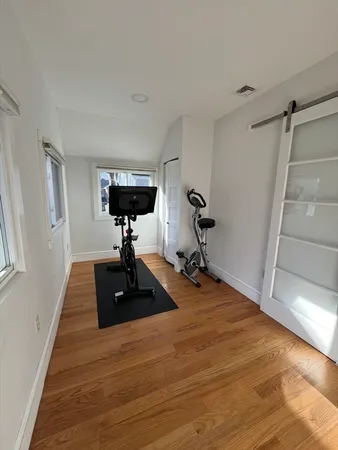 a room with gym equipment and a table