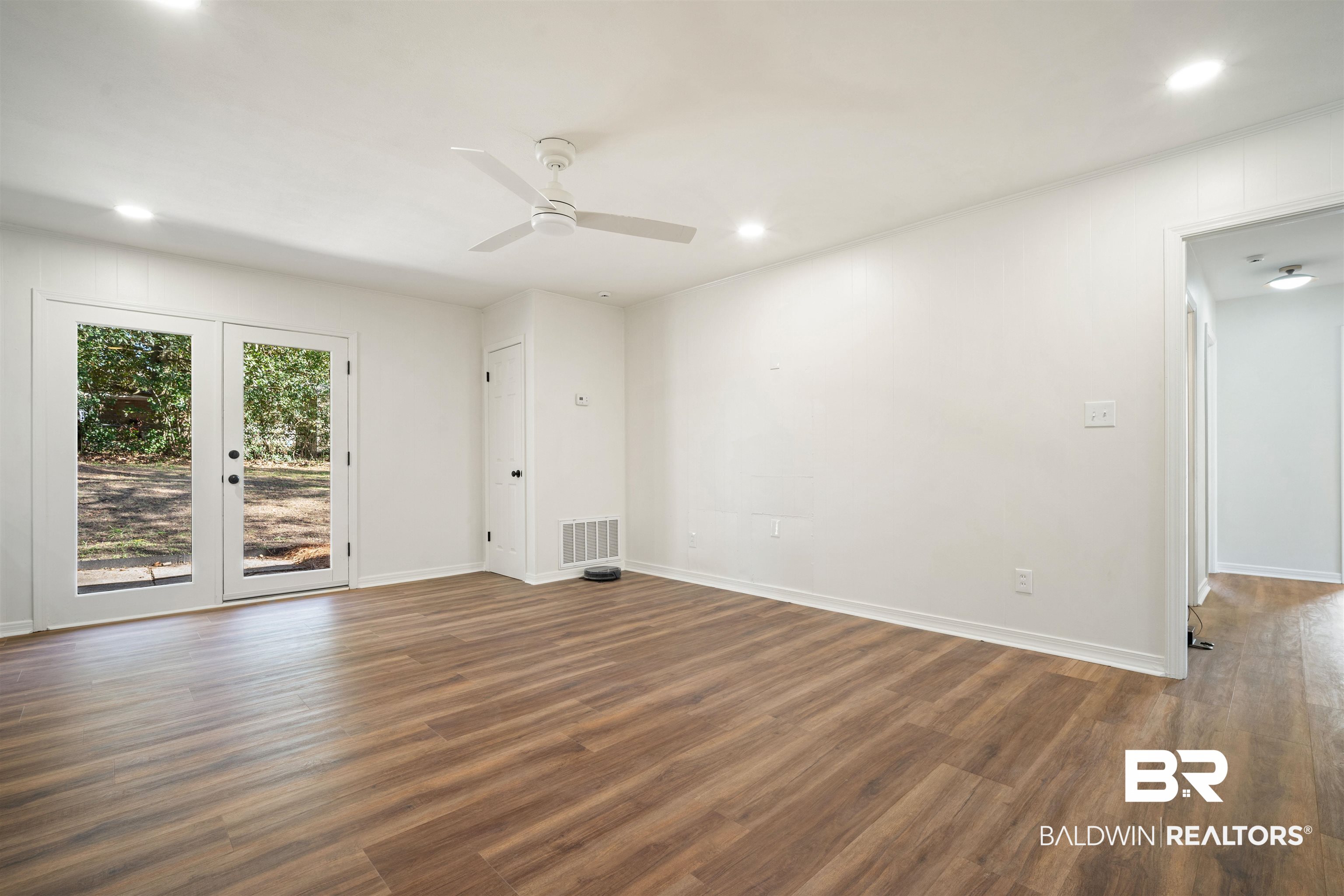 Unfurnished living room with recessed lighting, wood finished floors, and ceiling fan