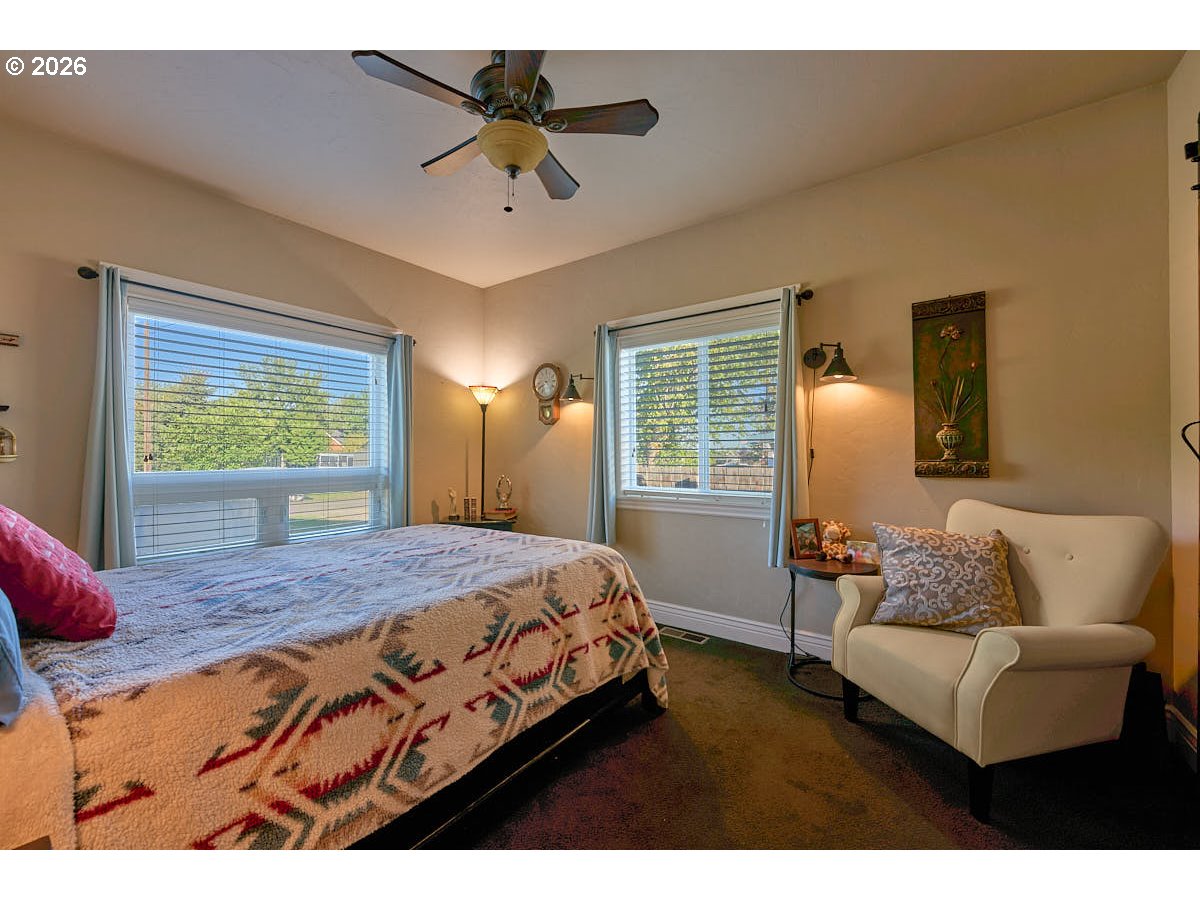 612 North Mill Street Joseph, OR 97846 - Photo 18 of 32 a bedroom with a bed a couch and dresser