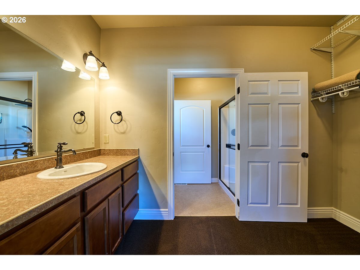 612 North Mill Street Joseph, OR 97846 - Photo 19 of 32 a bathroom with a sink and a mirror