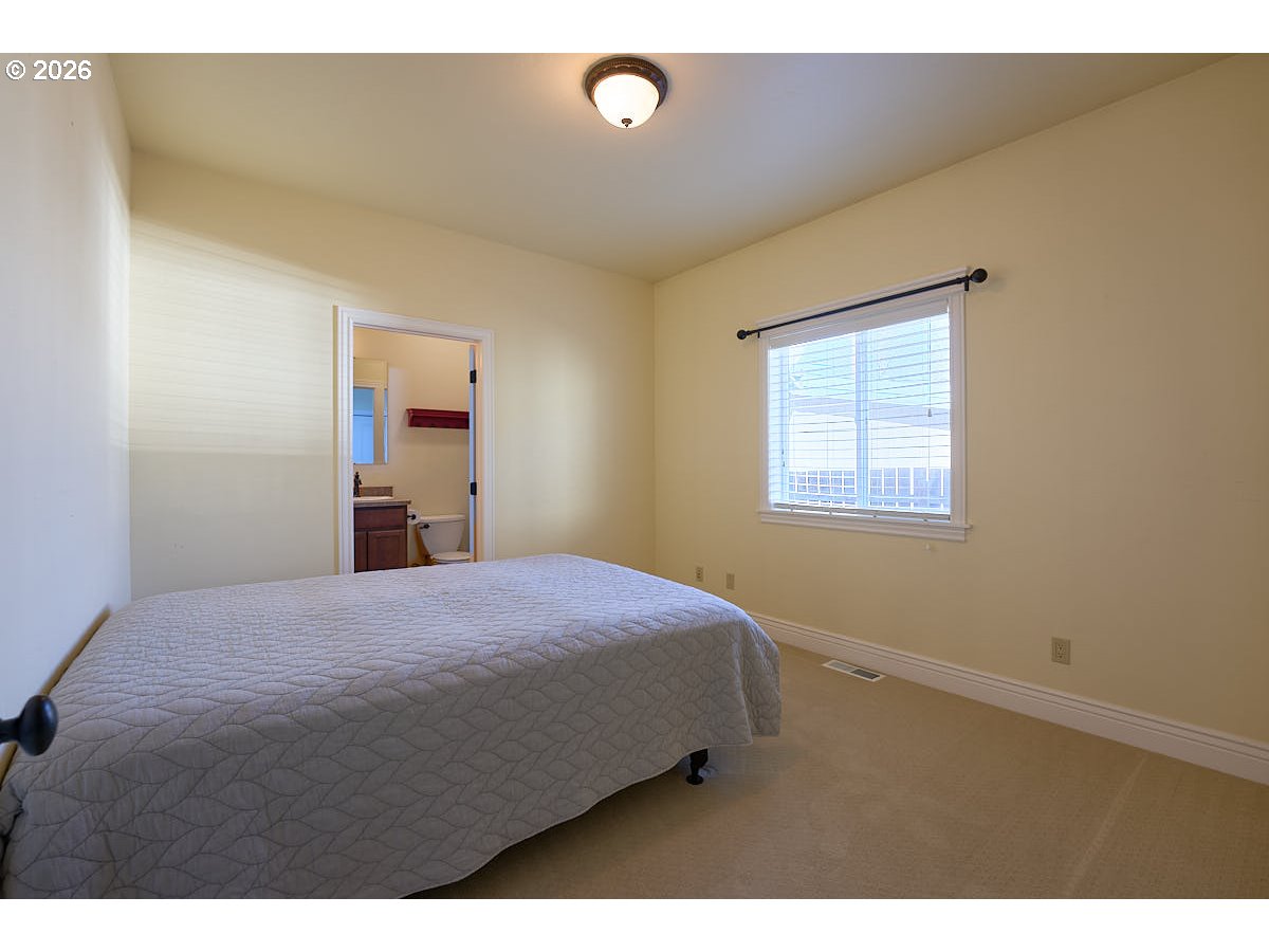 612 North Mill Street Joseph, OR 97846 - Photo 21 of 32 a bedroom with a bed and a window