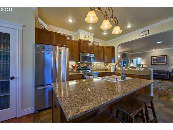 a kitchen with counter top space cabinets and stainless steel appliances
