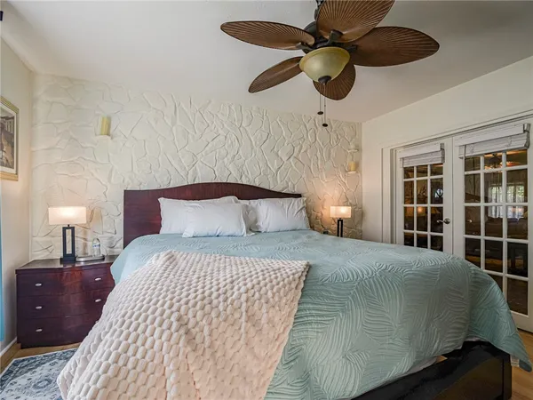 a bedroom with a bed and cabinets