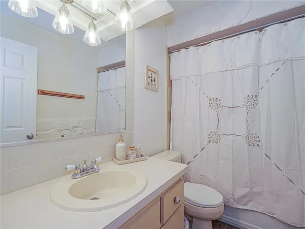 a living room with furniture a rug and a window