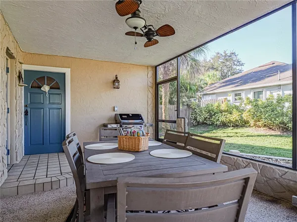 a view of a dining room with furniture and a rug