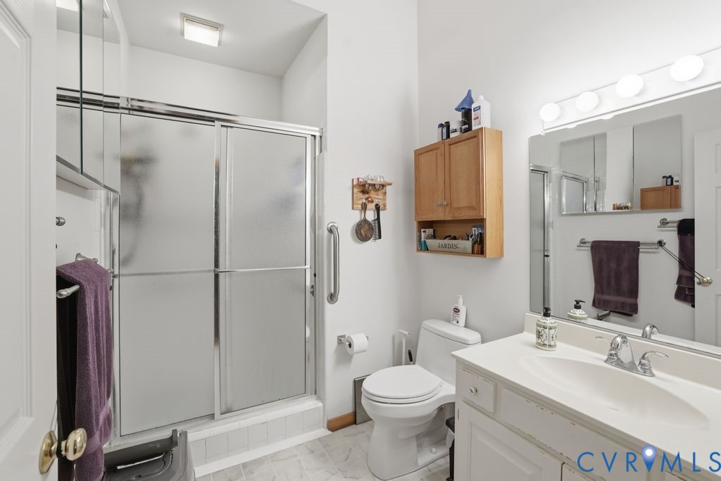 1061 Turkey Ridge Drive Moseley, VA 23120 - Photo 27 of 51 a bathroom with a sink toilet and shower