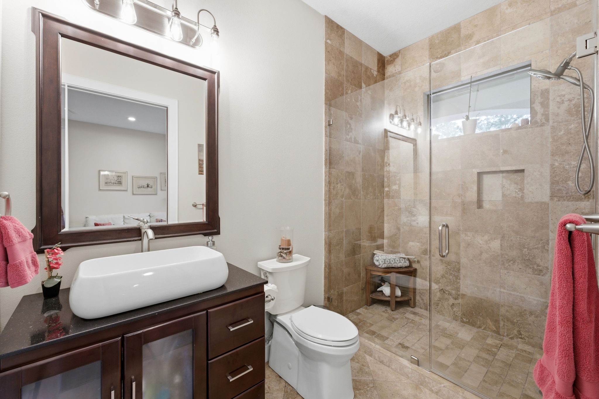 280 Sundog Road Huntsville, TX 77340 - Photo 34 of 50 Upstairs bathroom featuring a walk-in travertine shower serving the game room and flexible living space.