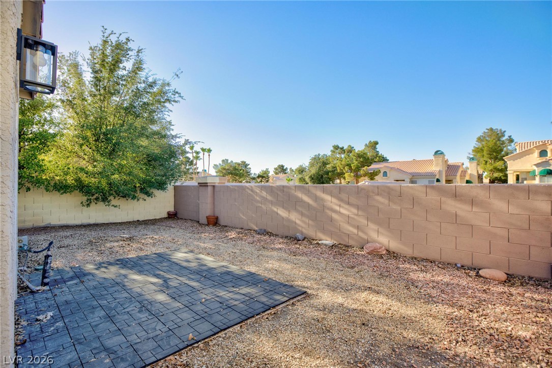 2254 Ramsgate Drive Henderson, NV 89074 - Photo 32 of 43 A spacious, low-maintenance backyard retreat featuring a versatile patio area for outdoor enjoyment.