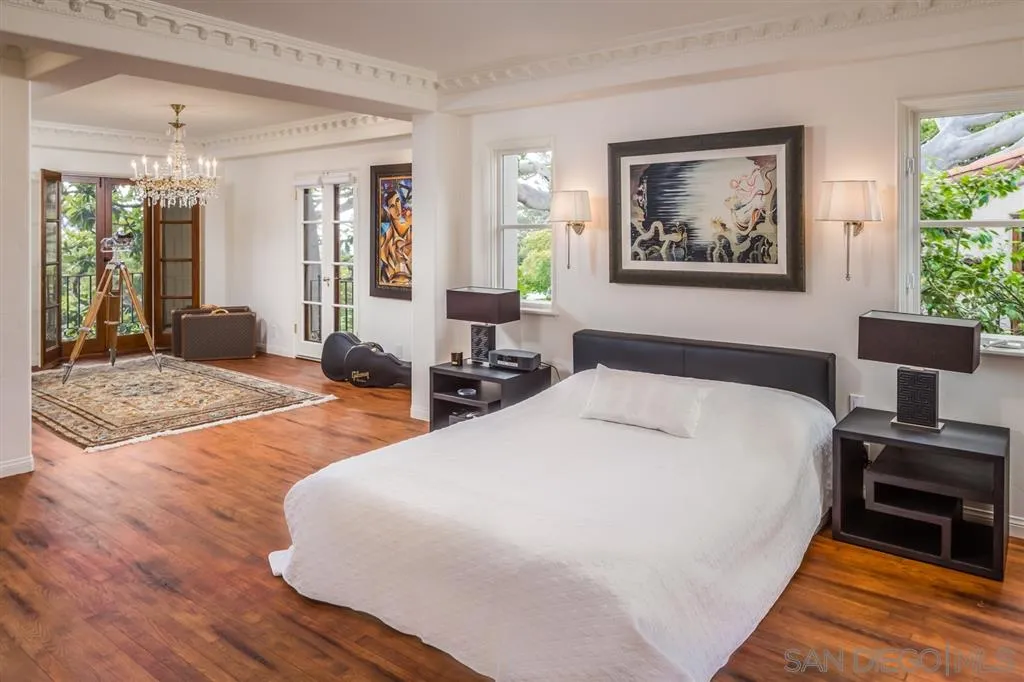 901 Highland Avenue Del Mar, CA 92014 - Photo 12 of 25 a spacious bedroom with wooden floor and large window