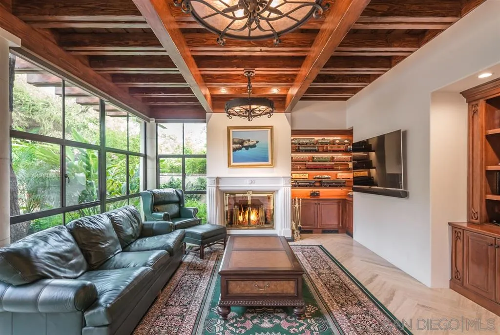 901 Highland Avenue Del Mar, CA 92014 - Photo 5 of 25 a living room with furniture and a fireplace