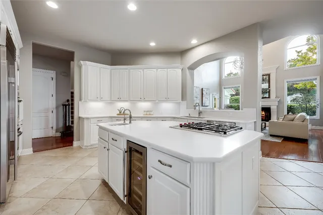 a kitchen with a stove a sink and a refrigerator