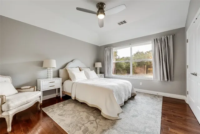 a bedroom with bed and a window