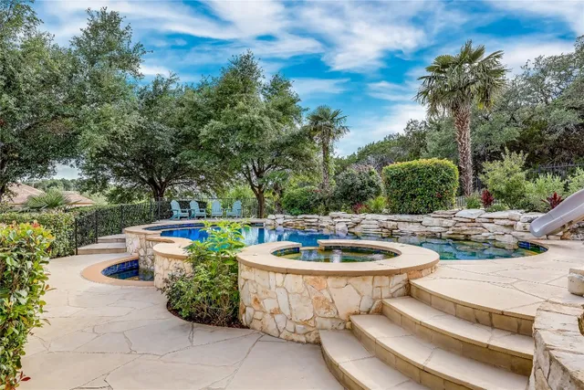 a view of a backyard with sitting area
