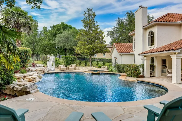 a view of a house with swimming pool