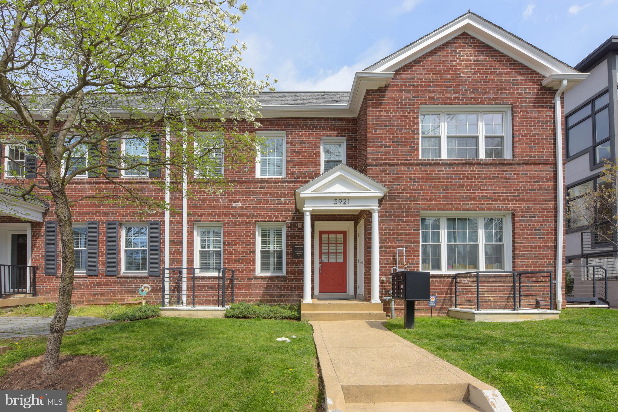 3921 Fulton Street Northwest, Unit 3 Washington, DC 20007 - Photo 1 of 24 a front view of a house with a yard