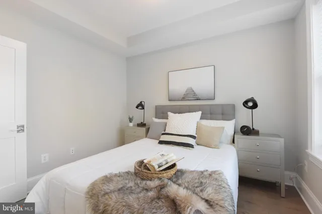 a bedroom with a bed and lamp