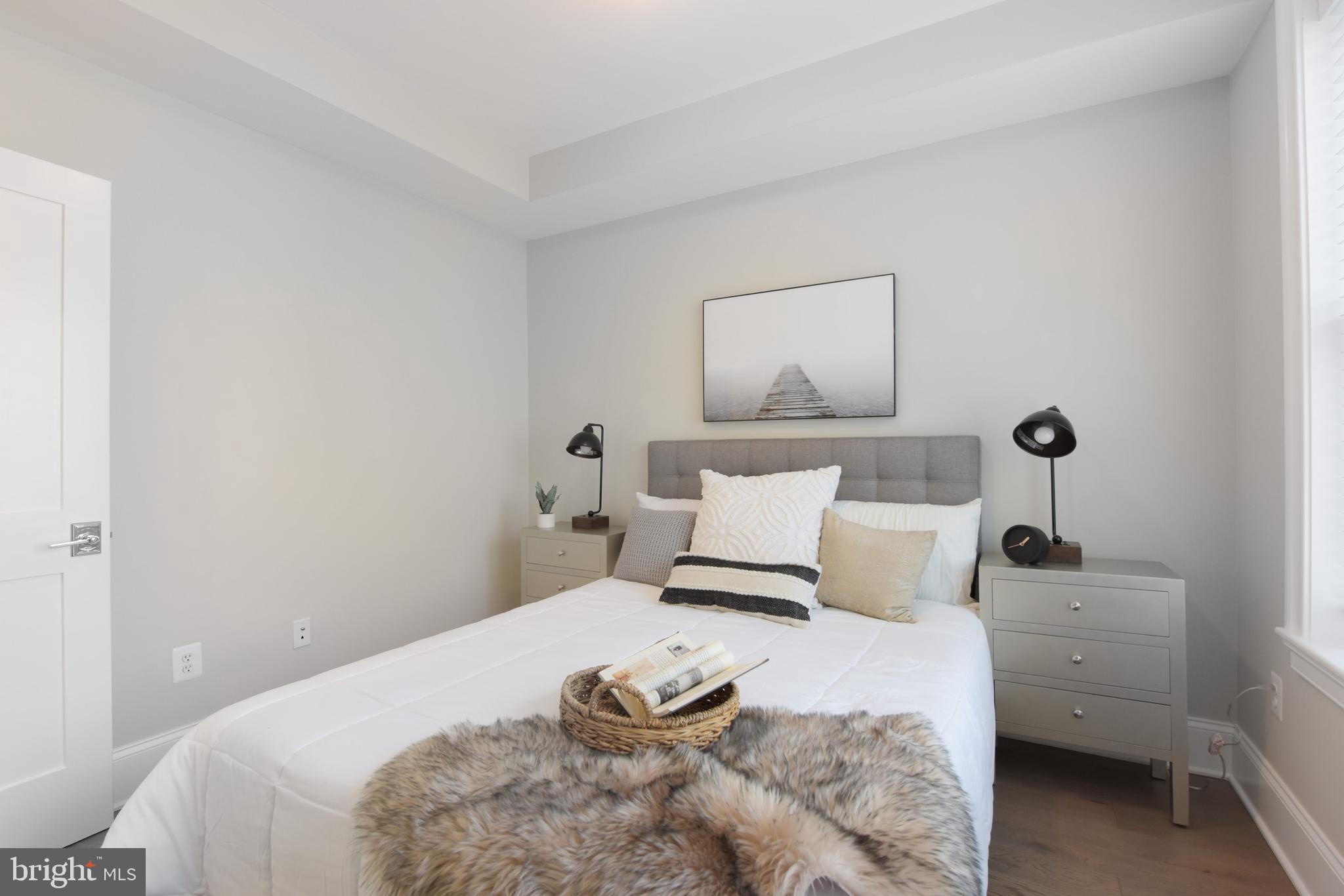 3921 Fulton Street Northwest, Unit 3 Washington, DC 20007 - Photo 13 of 24 a bedroom with a bed and lamp