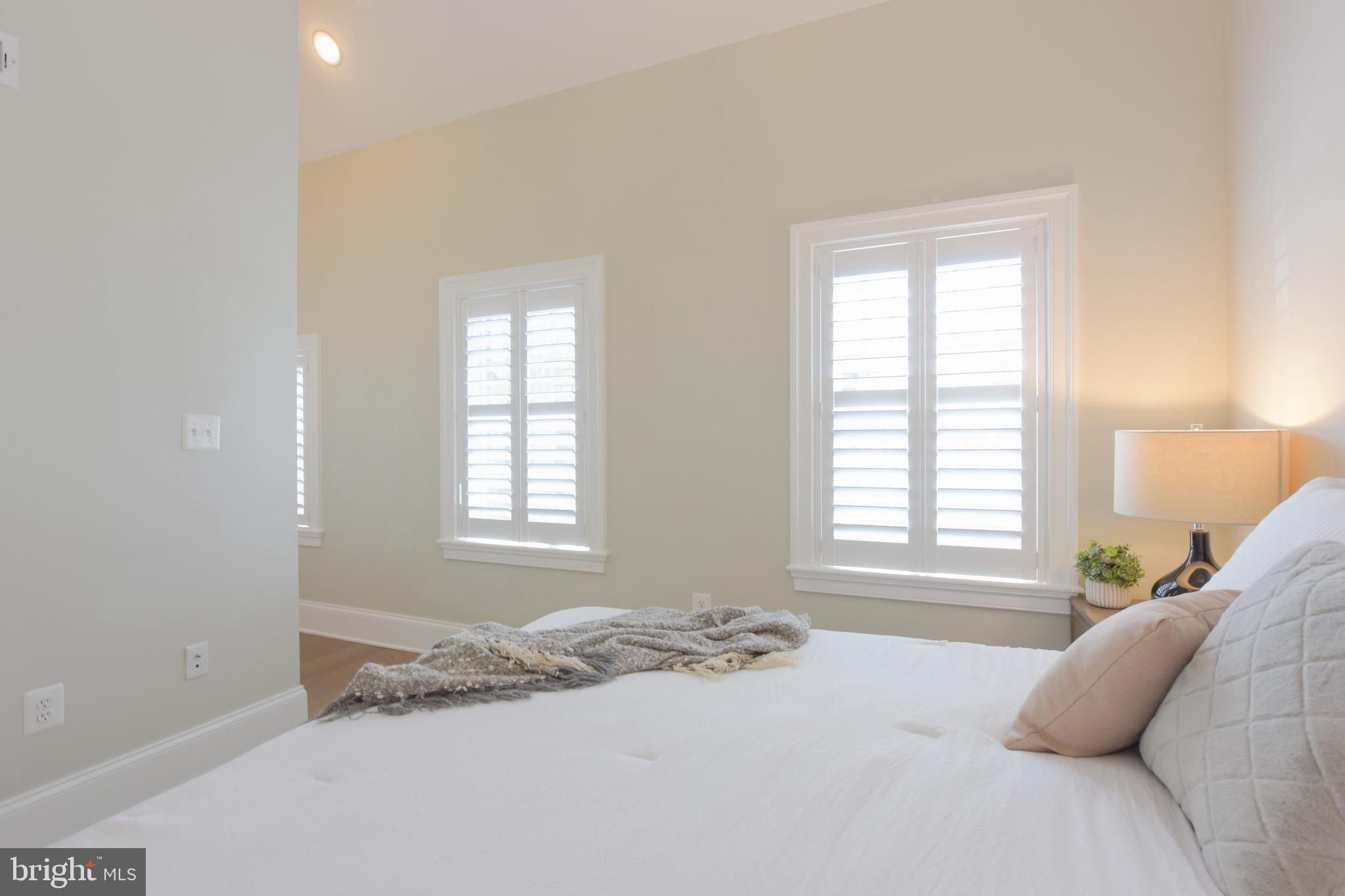 3921 Fulton Street Northwest, Unit 3 Washington, DC 20007 - Photo 22 of 24 a bedroom with a bed and a window