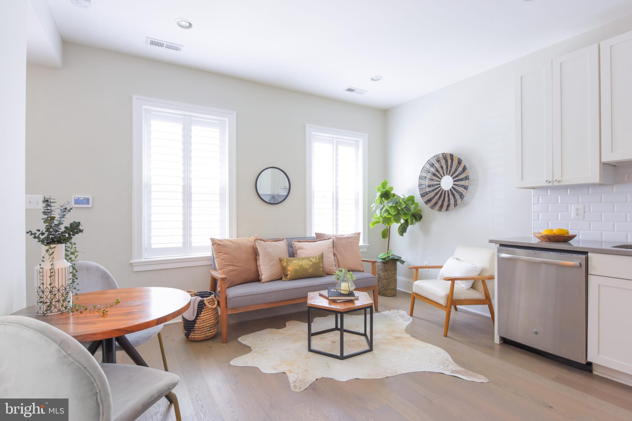 3921 Fulton Street Northwest, Unit 3 Washington, DC 20007 - Photo 3 of 24 a living room with furniture and a window