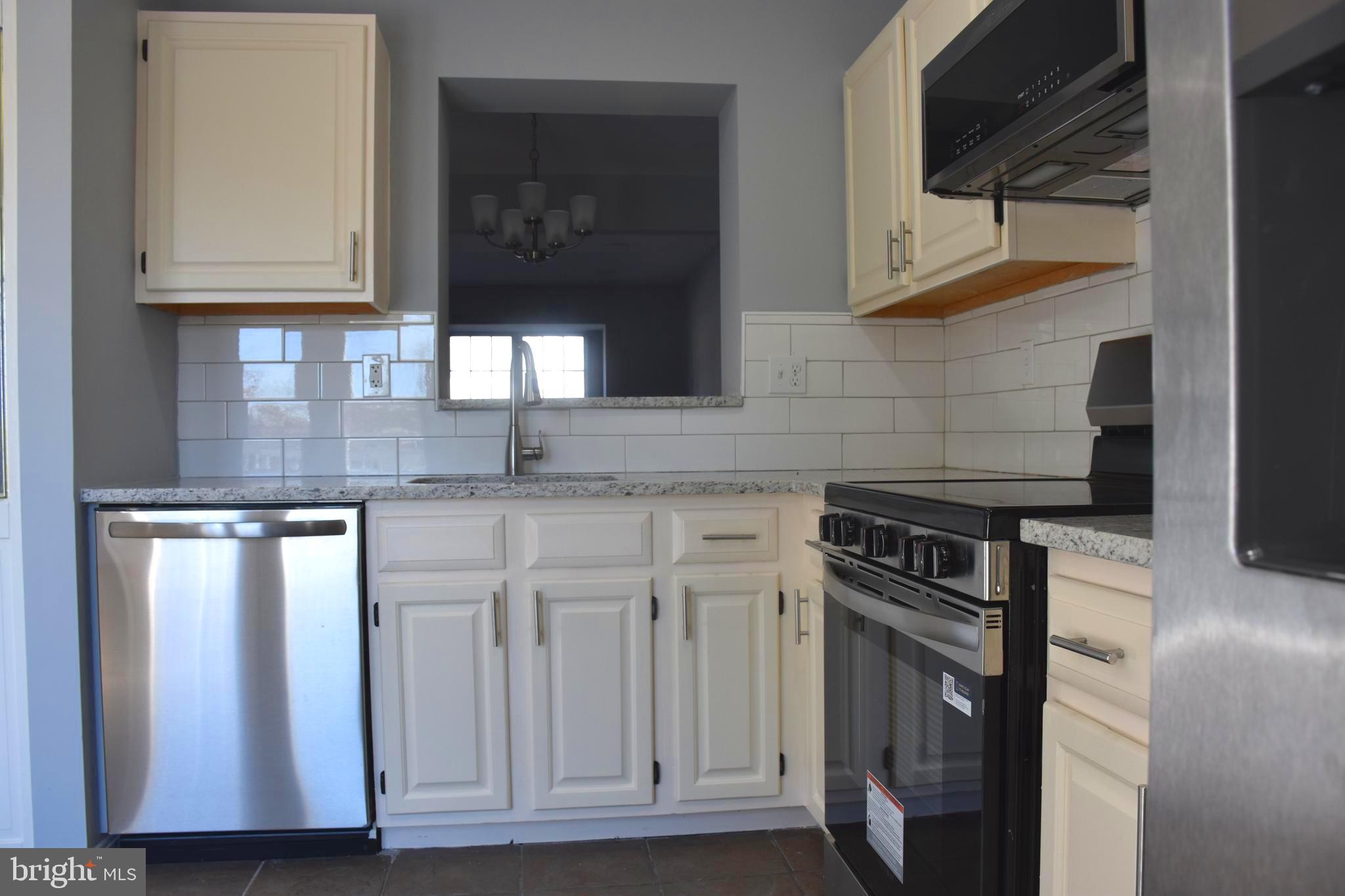 4211 Chapelgate Place Belcamp, MD 21017 - Photo 1 of 20 a kitchen with granite countertop cabinets stainless steel appliances and a counter space