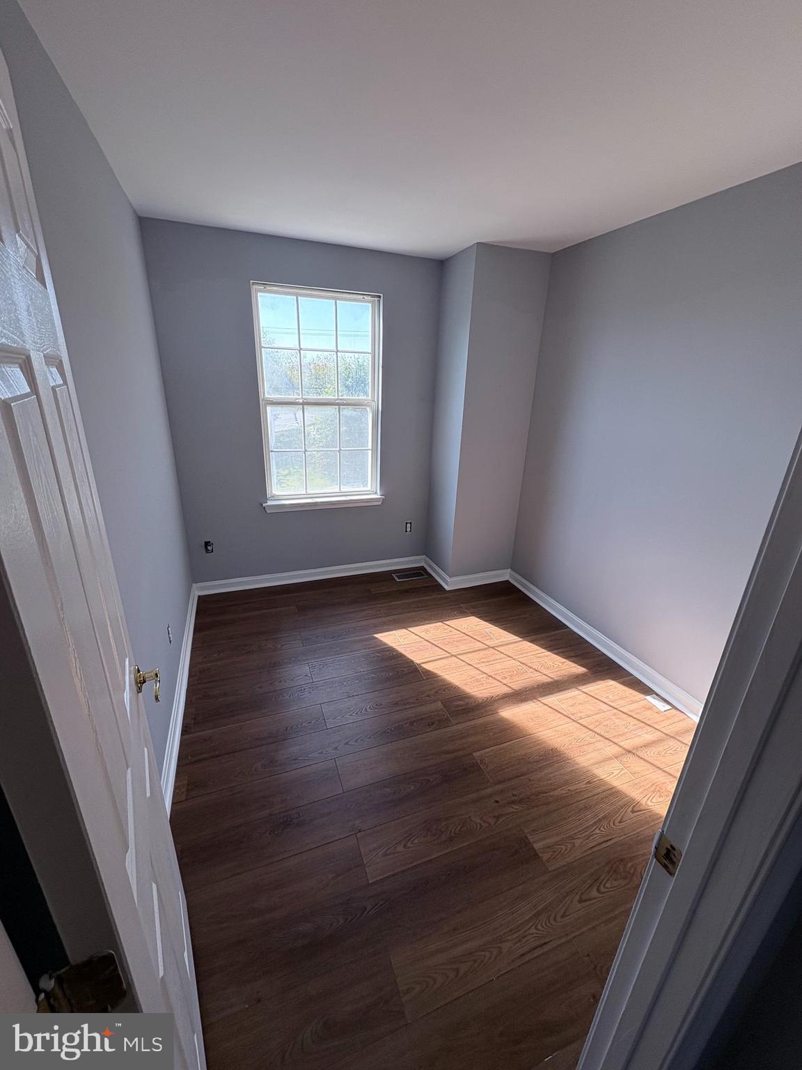 4211 Chapelgate Place Belcamp, MD 21017 - Photo 11 of 20 an empty room with wooden floor and windows