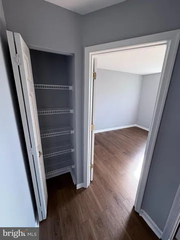 an empty room with wooden floor