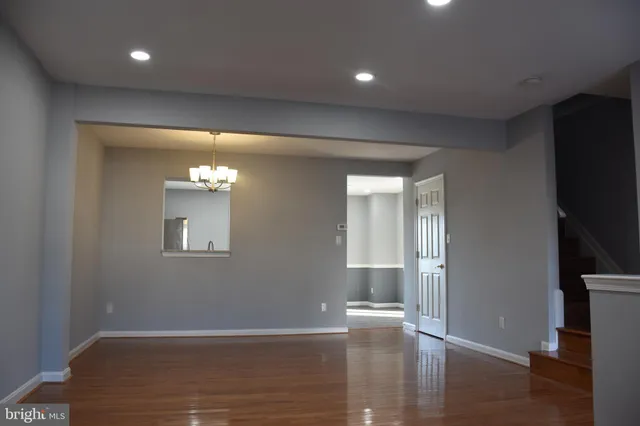 a view of livingroom with hardwood floor and hallway