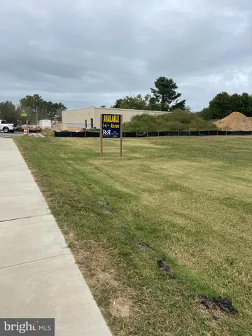 a view of a lake with a yard