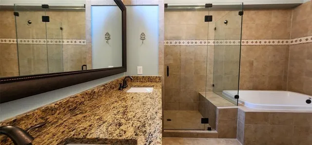 a white toilet sitting next to a shower