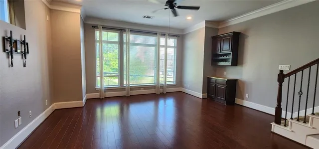 a view of hallway with wooden floor