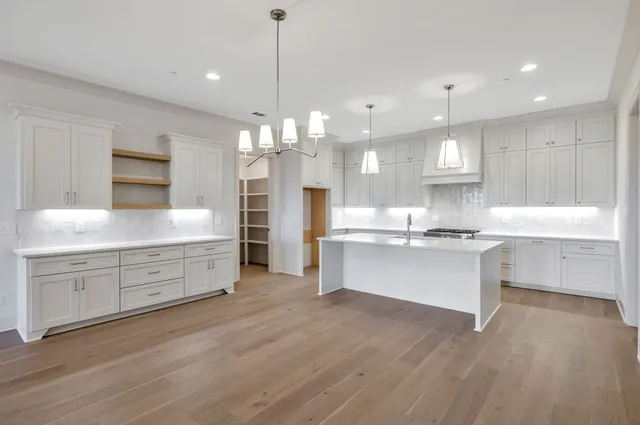 a view of cabinets with wooden floor